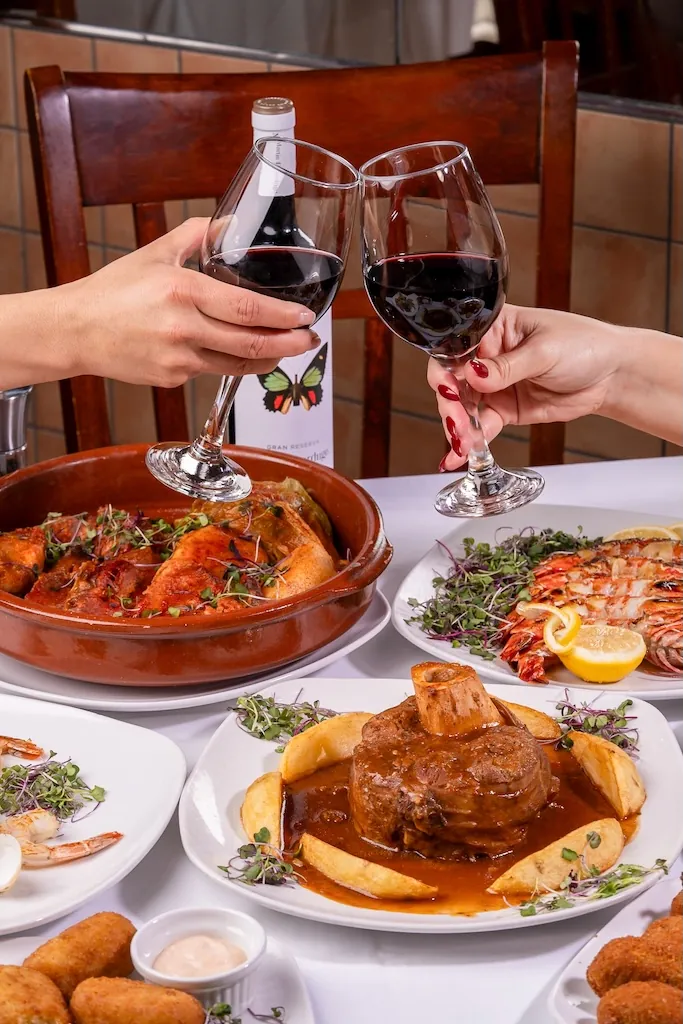 Guests toasting with Spanish wine at Los Gallegos Miami